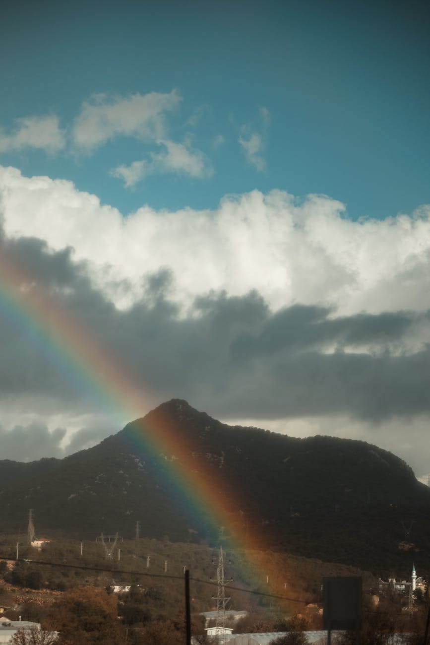 rainbow against mountains